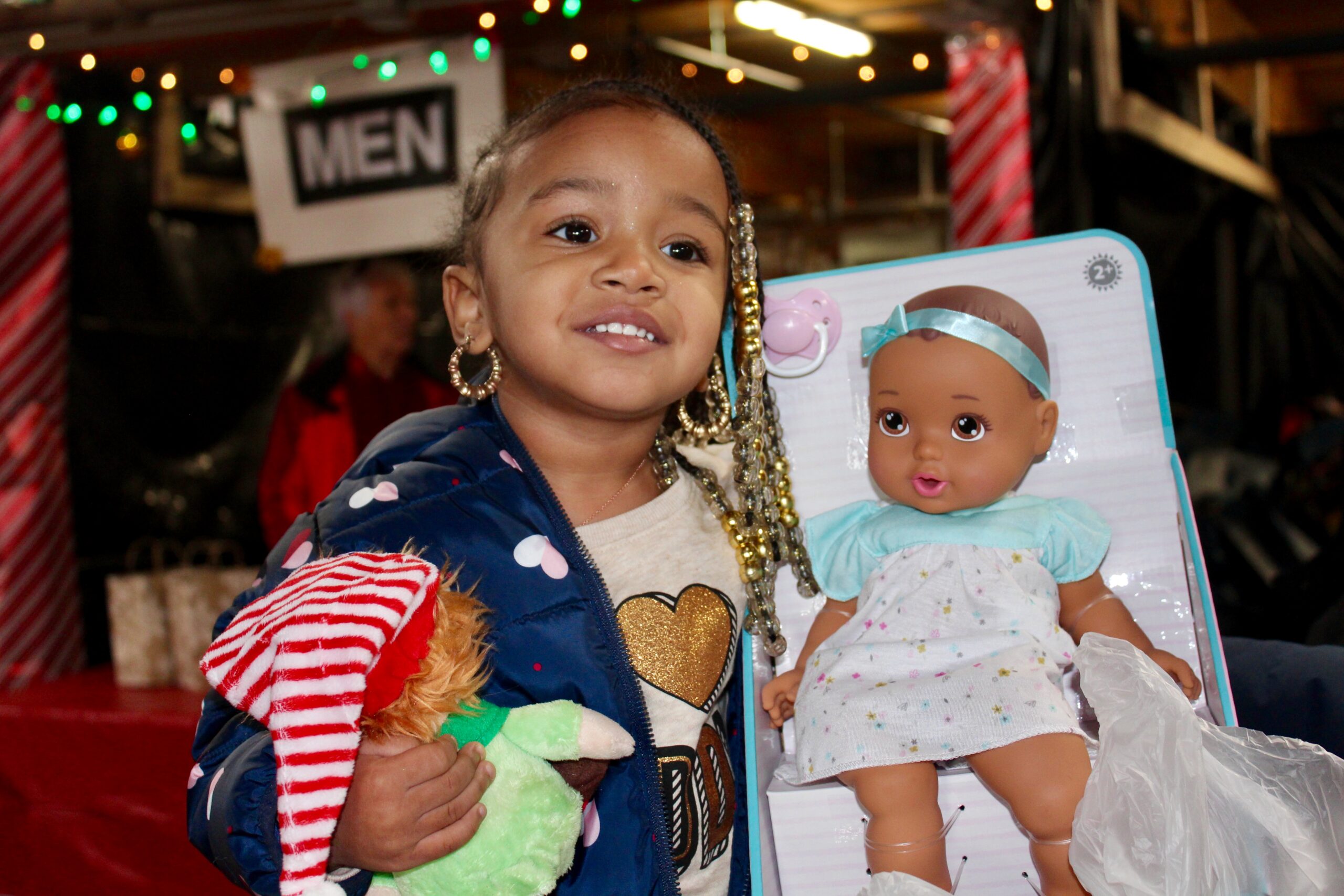 Little girl with Christmas gifts