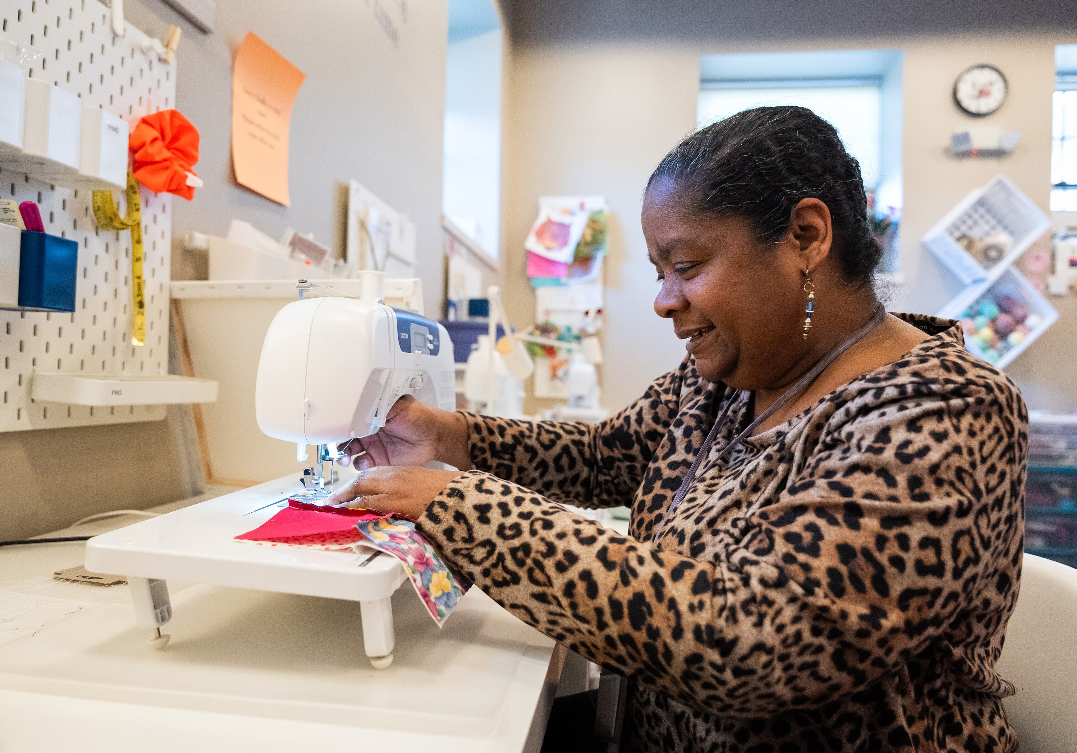 Cristeen working at a sewing machine