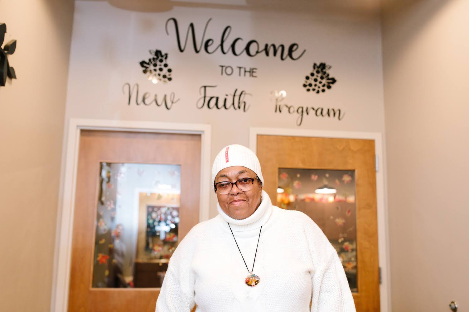 Woman at the New Faith Program entrance
