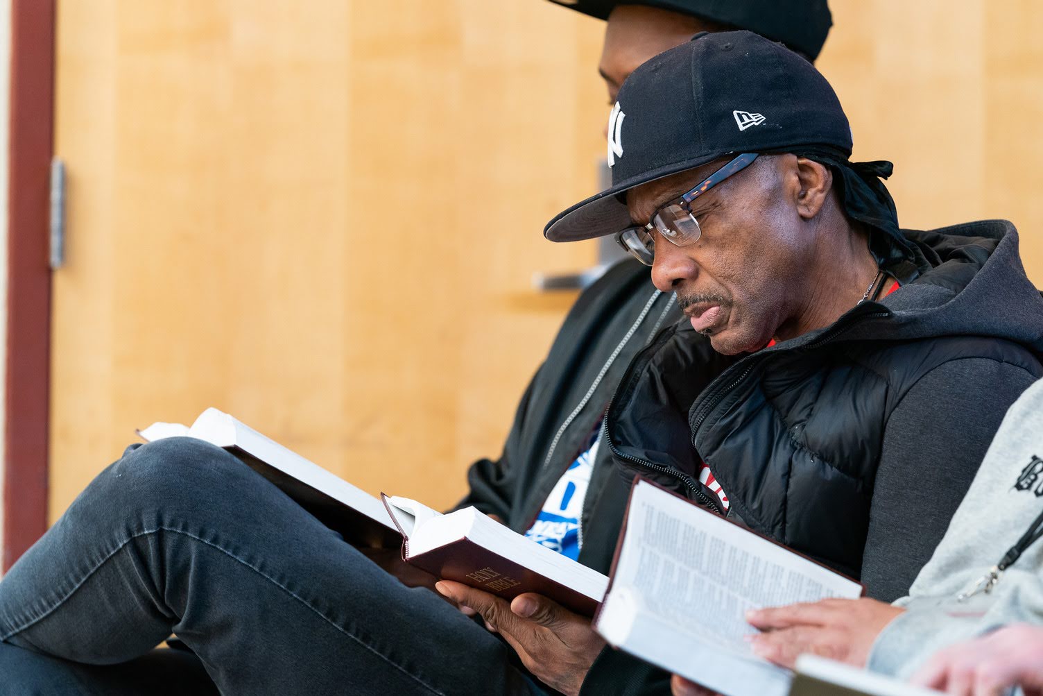 Celebrate Recovery participant reading during a group meeting