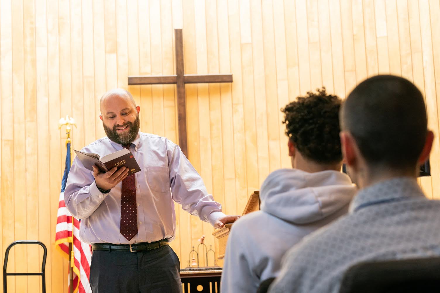Pastor sharing Scripture with chapel guests