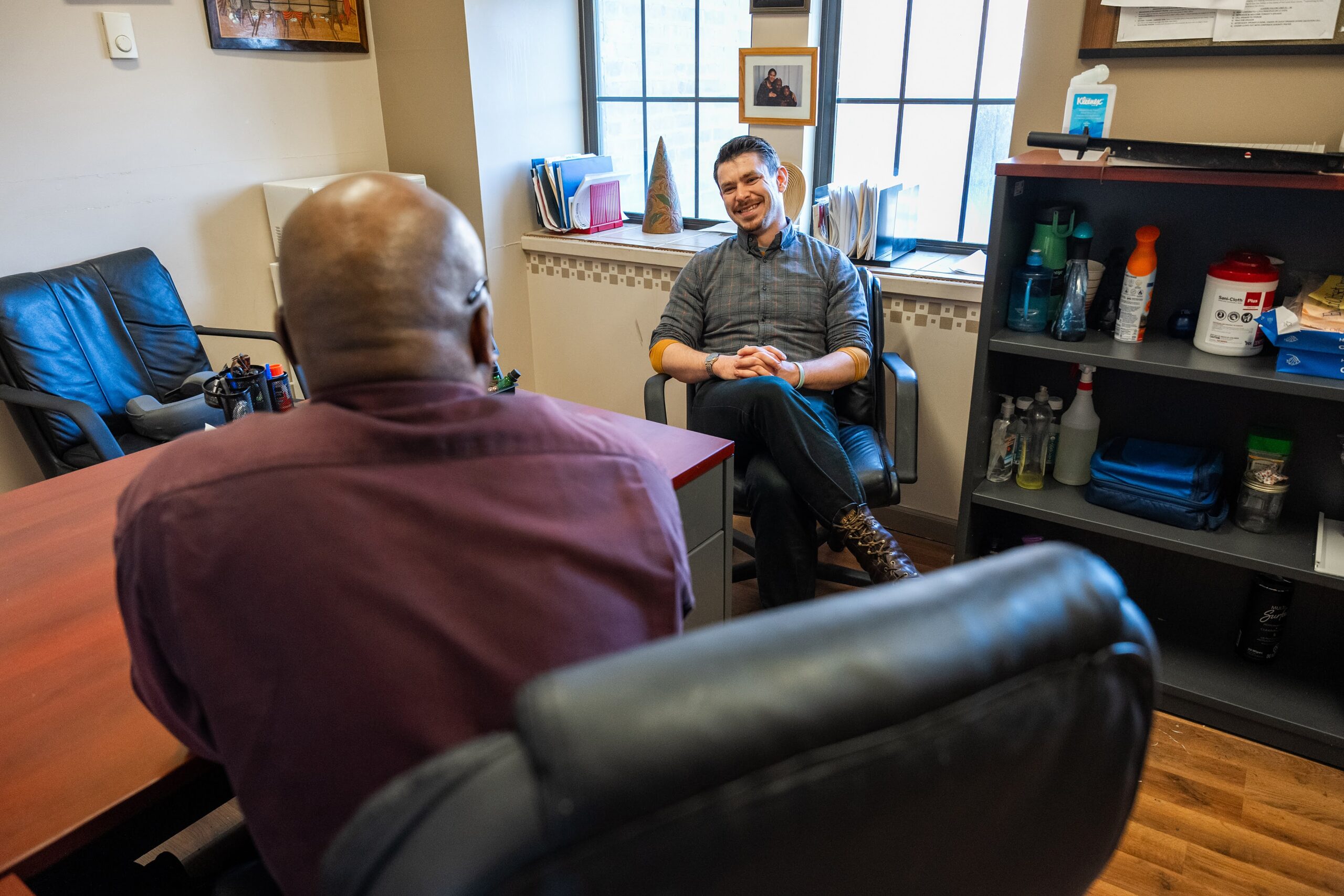 A Mission staff member meeting with a guest